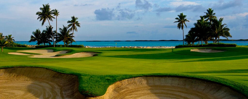 Golf course photograph of The Ocean Club on Paradise Island, Bahamas, featuring palm-lined greens and ocean views.