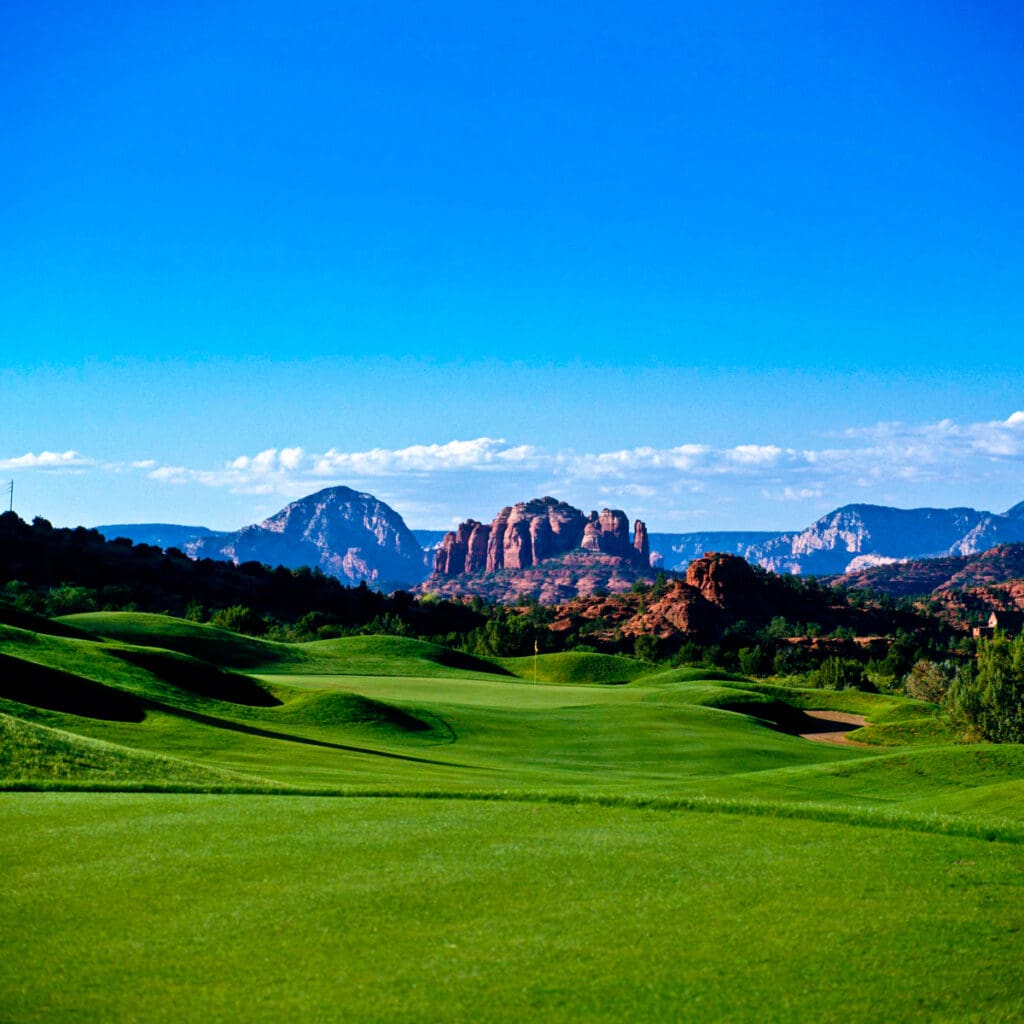 Golf course photograph of Sedona Golf Resort in Arizona, showing green fairways set against iconic red rock formations.