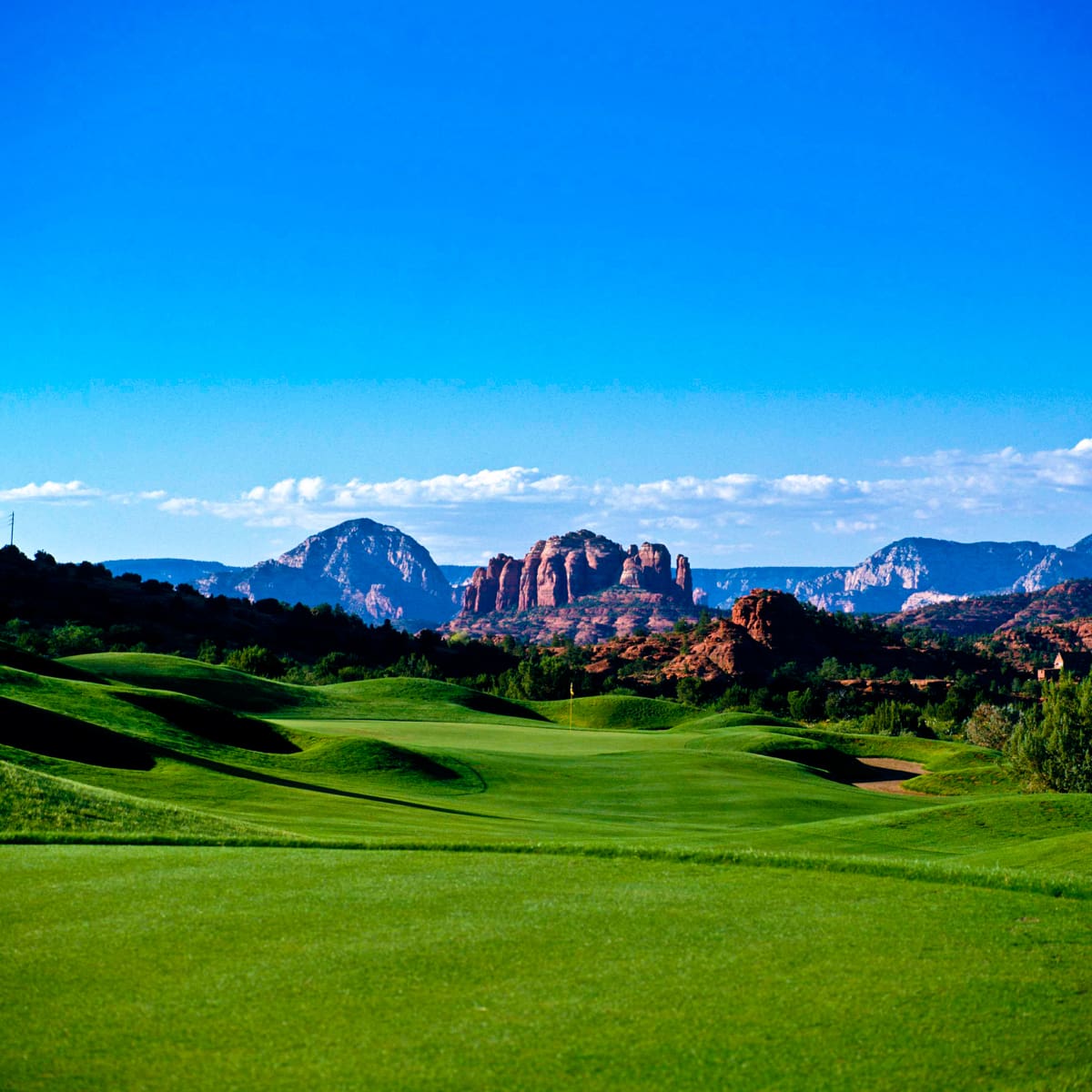 Golf course photograph of Sedona Golf Resort in Arizona, showing green fairways set against iconic red rock formations.