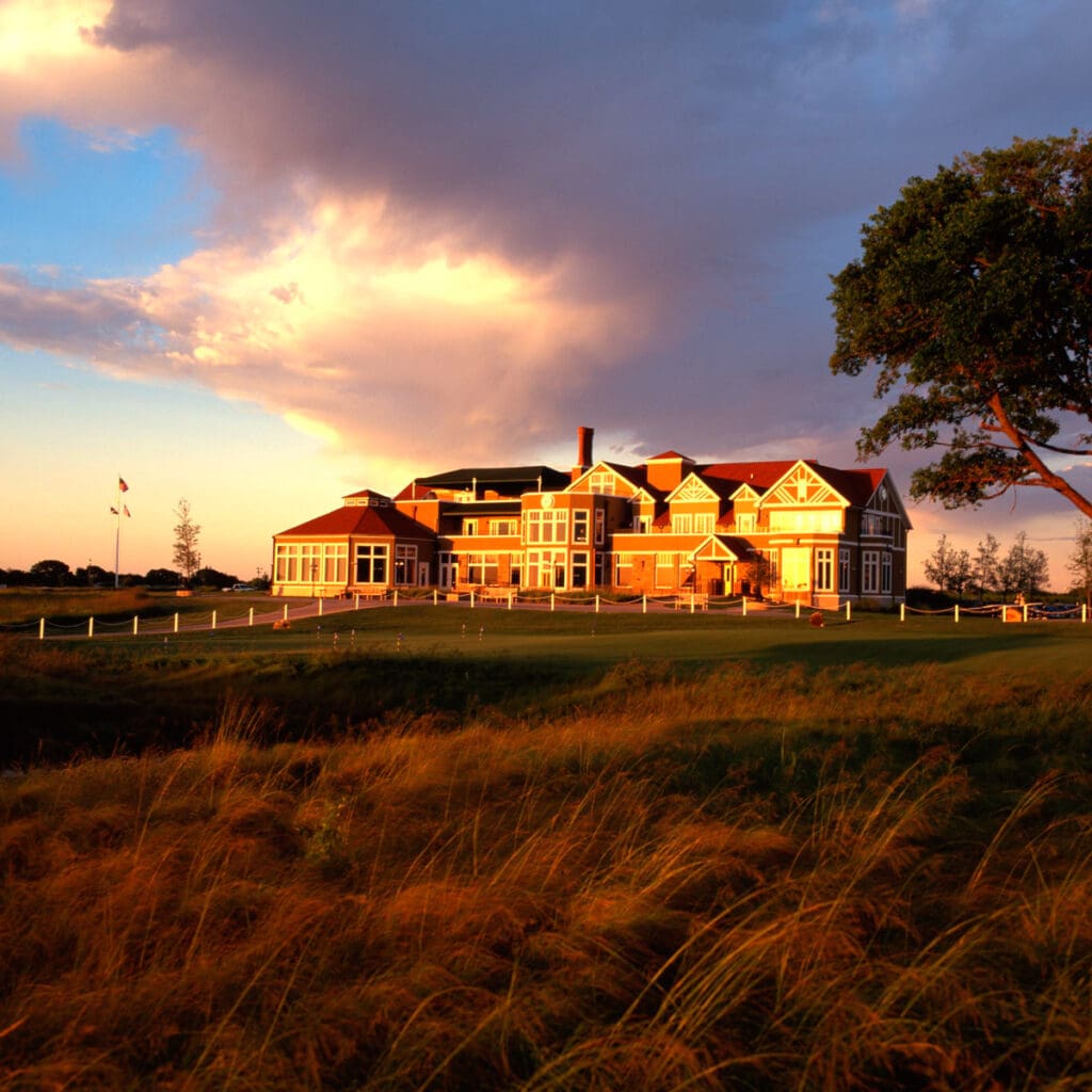 Golf course photograph of The Tribute Golf Club in The Colony, Texas, featuring clubhouse architecture and rolling fairways.
